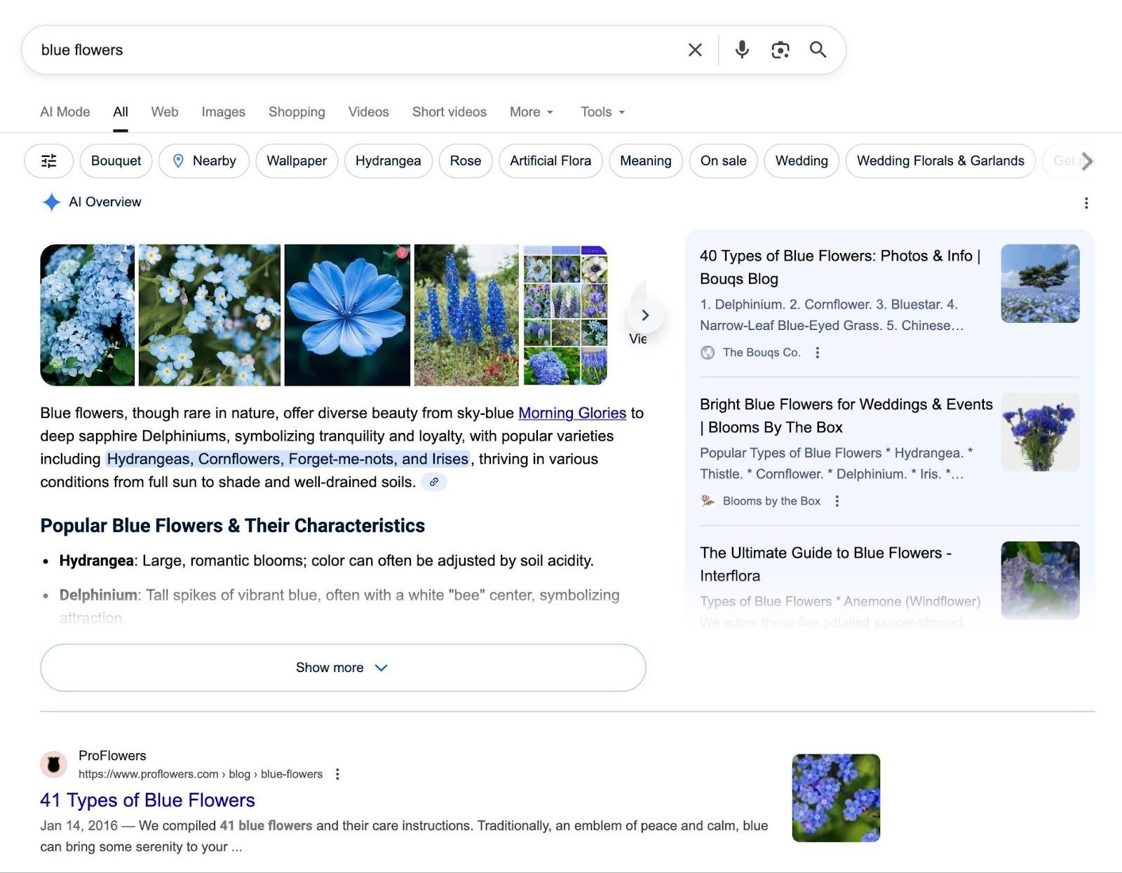 SERP for the term "blue flowers" with an AI Overview at the top followed by an informational article.